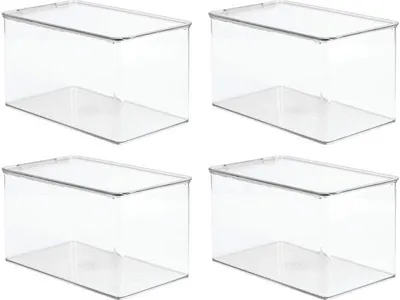 Four transparent storage boxes with lids are arranged in a two-by-two grid on a white background.