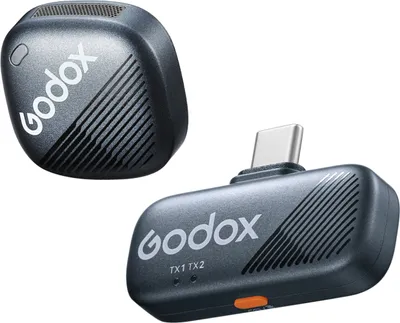 Two wireless microphone transmitters are shown against a white background.