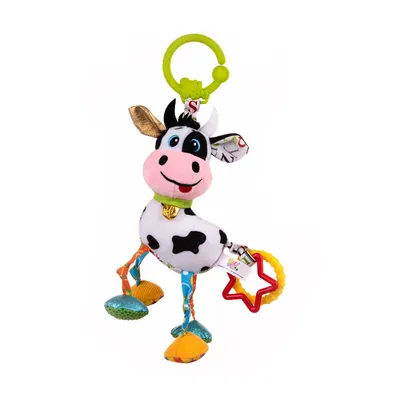 A stuffed toy cow hanging from a green ring.