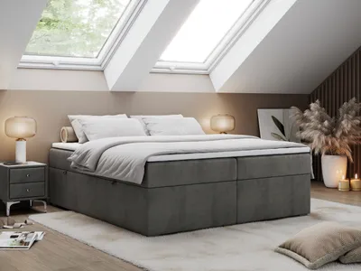 A bedroom scene with a bed, nightstand, and decorative elements.