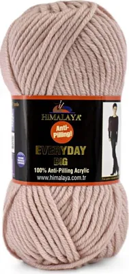 A ball of pink yarn with a label wrapped around it.