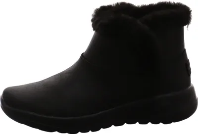 A black Skechers boot with faux fur trim is shown against a white background.