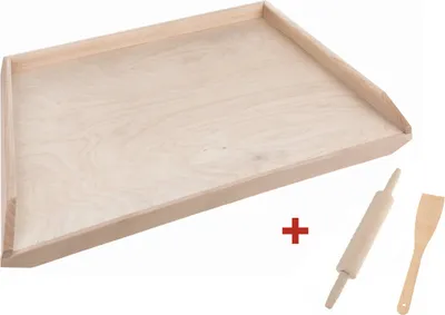 A wooden baking board with a rolling pin and spatula.