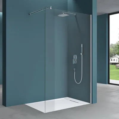 A modern walk-in shower enclosure with a glass wall, showerhead, and handheld shower.