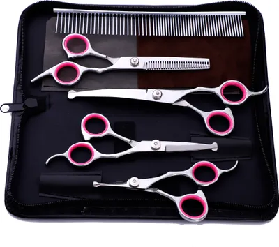 A set of grooming scissors and a comb laid out in a black case.