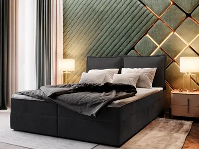 A bedroom scene featuring a large bed with a dark upholstered frame and headboard, dressed in dark gray bedding and white pillows. The headboard is complemented by a striking, textured green wall paneling with gold geometric accents and integrated lighting