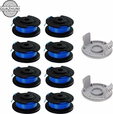 A collection of trimmer spools and caps arranged on a white background.