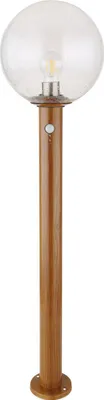 A standalone outdoor lamp with a wooden-look base and a clear glass shade.