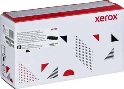 A white cardboard box with red and black geometric patterns, containing a Xerox toner cartridge.