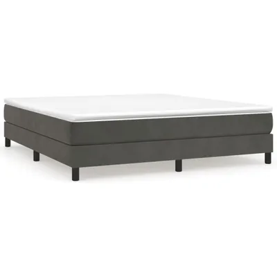 A dark gray box spring bed frame with a white mattress on top, shown from a side angle against a white background.