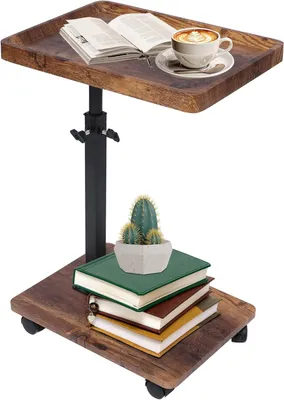 A C-shaped side table with a wooden top and base, a black adjustable pole, and wheels. It has a book and a cup of coffee on the top shelf, and a potted cactus on a stack of books on the bottom shelf.