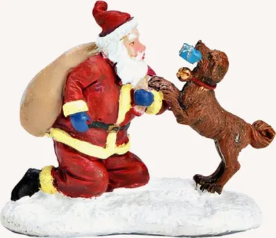 Eine niedliche Weihnachtsfigur, die den Weihnachtsmann zeigt, der einem Hund ein Geschenk gibt.
