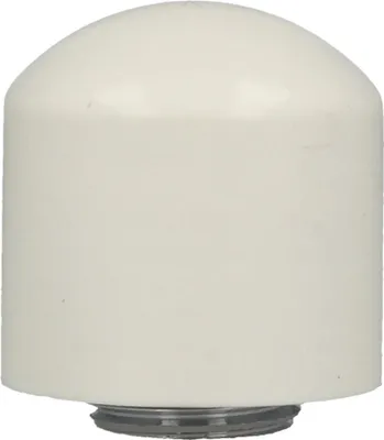 A white cylindrical object with a rounded top, sitting on a gray base.