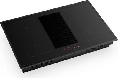 A black induction cooktop with an integrated downdraft ventilation system, shown from a slightly elevated angle against a white background.