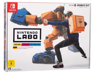 The image shows the packaging for the Nintendo Labo Toy-Con 02: Robot Kit, with a person demonstrating the robot suit.