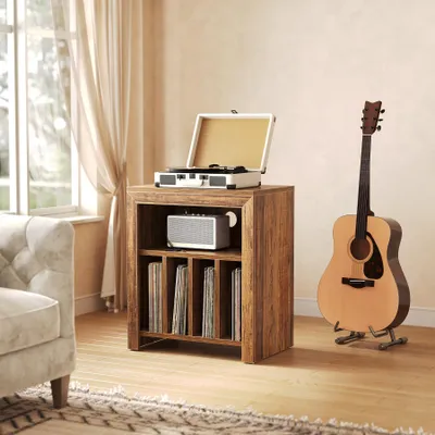 A living room scene featuring a record player stand with vinyl records, a record player, a speaker, and a guitar.