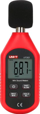 A red and black digital sound level meter with a black foam windscreen on top.