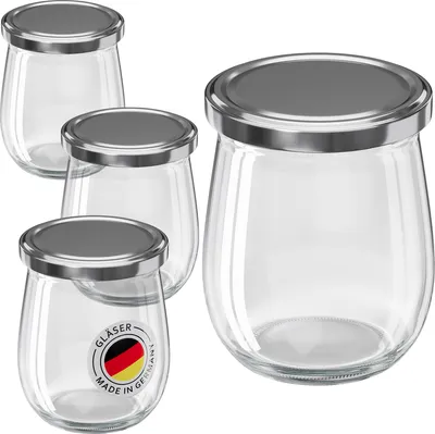 Four glass jars with silver lids are arranged on a white background. One jar in the foreground has a German flag logo and text on it.