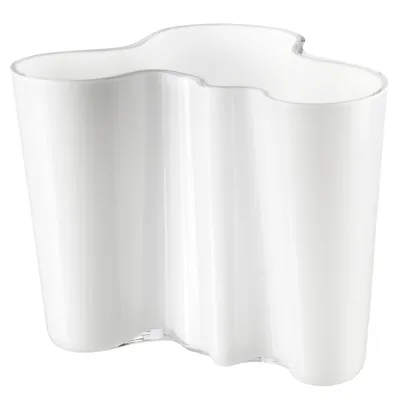 A white vase with a wavy, organic shape.
