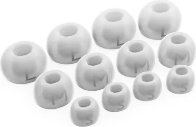 A collection of white silicone earbud tips of various sizes.