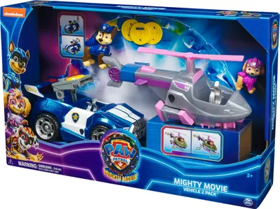 The image shows a toy playset from Paw Patrol: The Mighty Movie, featuring two vehicles and two figures in its retail packaging.