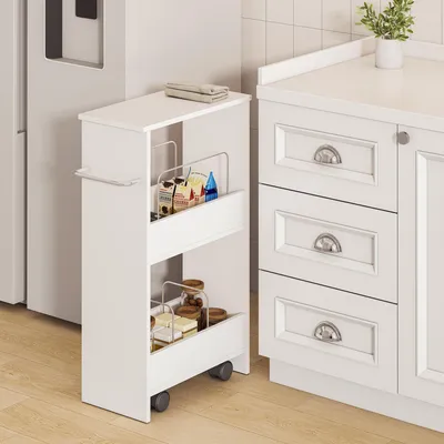 A white rollwagen with two shelves filled with various items, placed next to a white kitchen cabinet.