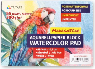 A watercolor pad with a parrot illustration on the cover.