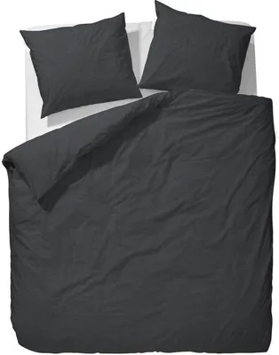 A top-down view of a dark gray duvet cover and two matching pillowcases laid out on a white surface.