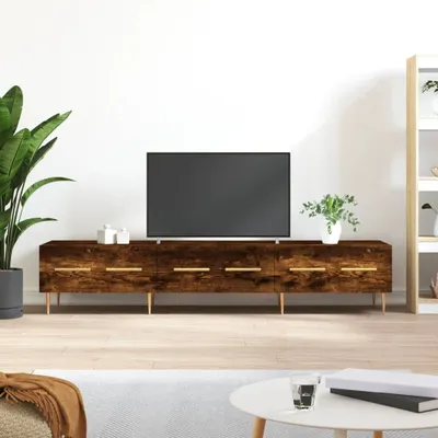 A TV stand with a television on it, in a room setting.