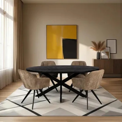 A dining room scene with an oval table and chairs, set on a rug with a large abstract painting on the wall.