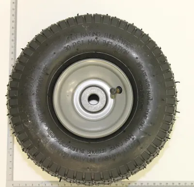A close-up, centered view of a single wheel with a tire and a metal rim.