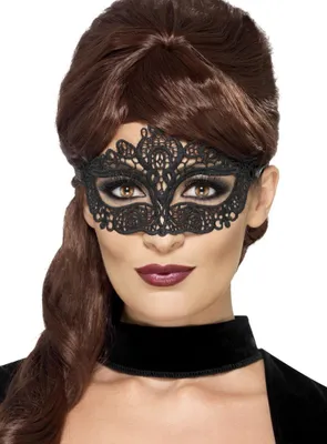 A woman wearing a black lace mask.