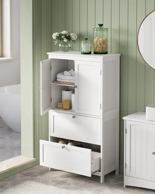 A white bathroom cabinet with open doors and one drawer pulled out, showing storage space. Decorative items like flowers and jars are on top of the cabinet.