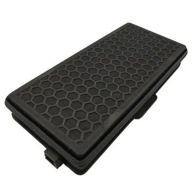 A black honeycomb-patterned air filter on a white background.
