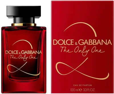 A bottle of Dolce & Gabbana The Only One 2 perfume and its matching red box, both featuring gold lettering and decorative swirls.