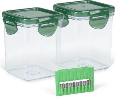 Two clear plastic food storage containers with green lids and a green accessory are displayed on a white background.