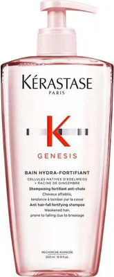 A pink pump bottle of Kérastase Genesis Bain Hydra-Fortifiant shampoo.