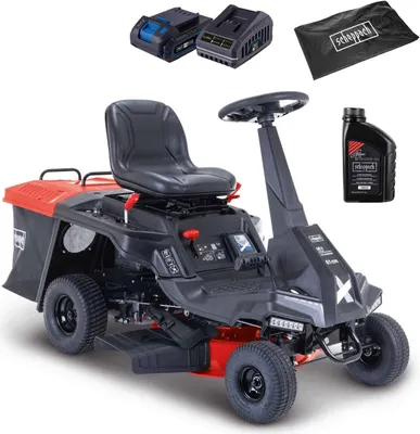 A Scheppach ride-on lawnmower with accessories including batteries, a charger, and oil. The product is shown from a slightly elevated front-side angle against a white background.