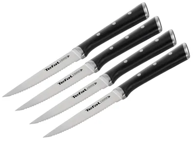 Four steak knives with black handles are arranged diagonally on a white background.