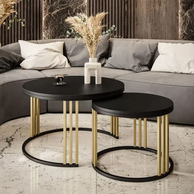 Two nesting coffee tables in a modern living room setting.
