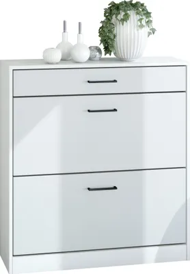 A white shoe cabinet with three drawers is shown against a white background. Decorative items, including a plant in a white pot, are placed on top of the cabinet.