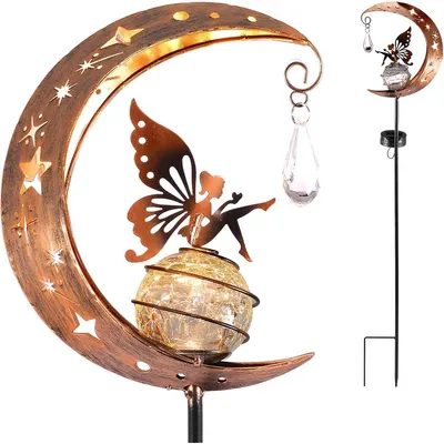 A decorative solar garden light shaped like a crescent moon with a fairy and a crystal pendant.