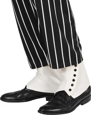 Close-up of a person's legs wearing black and white striped pants, white gaiters, and black shoes.