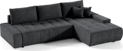A dark gray sectional sofa with tufted cushions is shown against a white background.