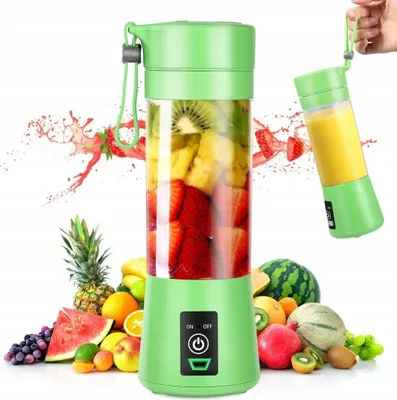 A portable blender filled with fruit and surrounded by various fruits.