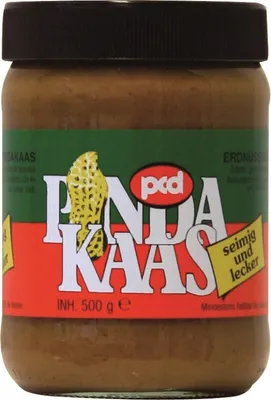 A jar of peanut paste on a white background.