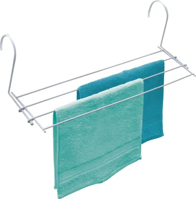 A white metal radiator drying rack with two towels hanging on it.