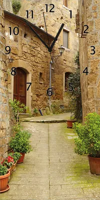 Produktbild von Wallario Design Wanduhr bedruckt, Größe 30 x 60 cm, Motiv: Weg durch die Altstadt - Toskana in Italien