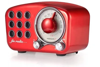 A red retro-style radio with a tuning dial and speaker grilles.