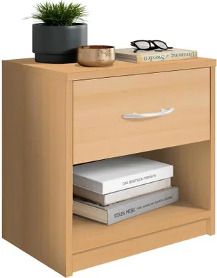 A light wood-colored nightstand with a drawer and an open shelf, displaying books, glasses, a plant, and a decorative bowl on top.
